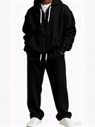 Men's plus size black waffle knit hooded sweatshirt and matching jogger pants set, relaxed fit streetwear.