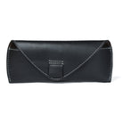 Black leather clutch bag on a white background