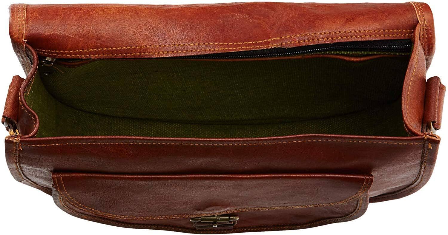 Brown leather bag with green interior on a white background