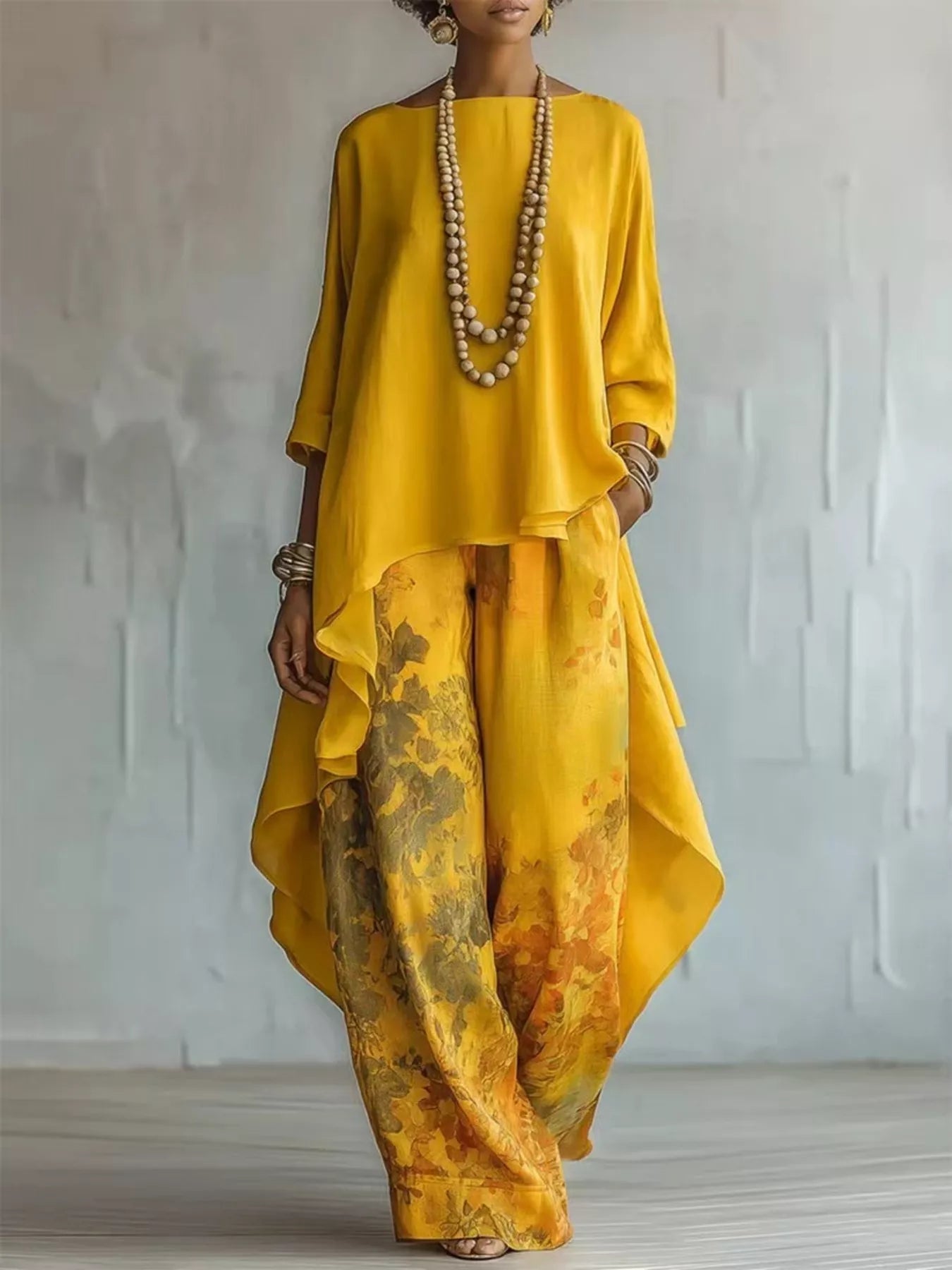 Person wearing a yellow outfit with a textured pattern against a plain background