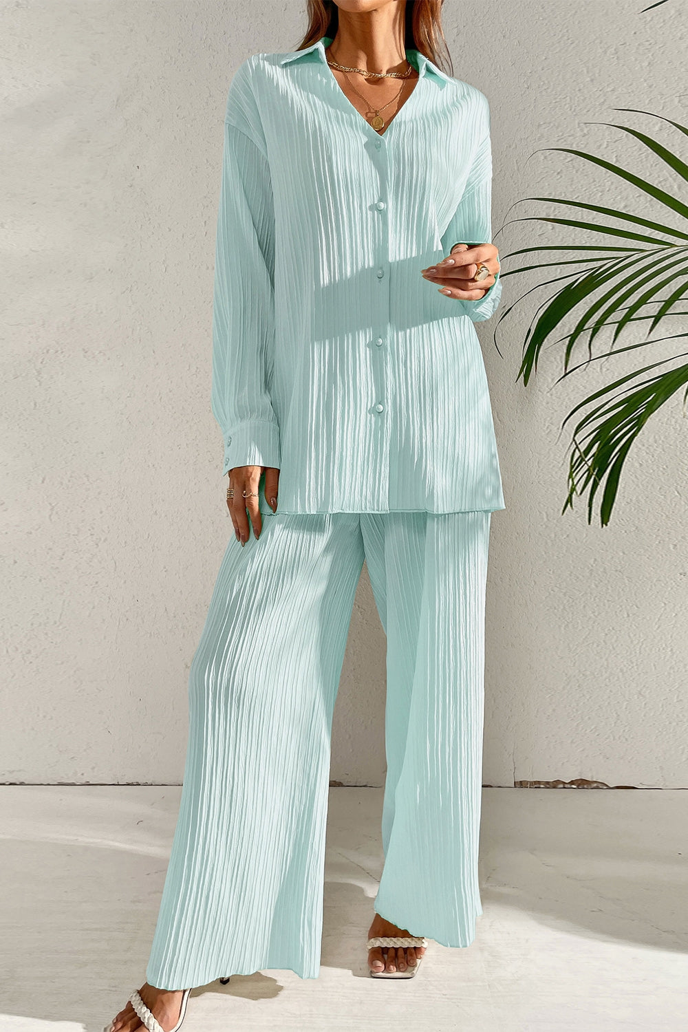 Full-length rear view of the Capri Collared Button-Down Pant Set in Pastel Blue, showcasing its structured collared top and fluid wide-leg lounge trousers against a clean, light background.