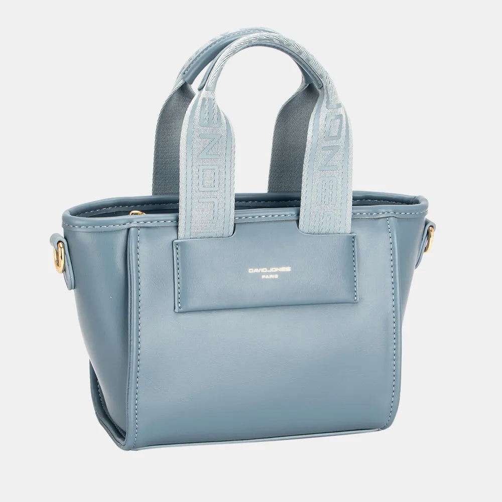 The Small Handbag with Embossed Pattern Handles offers a stylish, compact design with detailed embossed handles for a touch of luxury. Its structured form holds essentials neatly and can be carried by hand or with the detachable strap for versatile use. Ideal for both casual and formal occasions, this handbag combines elegance and practicality effortlessly.