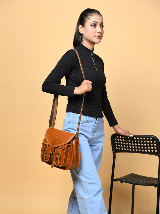 Woman carrying a brown leather bag against a beige background