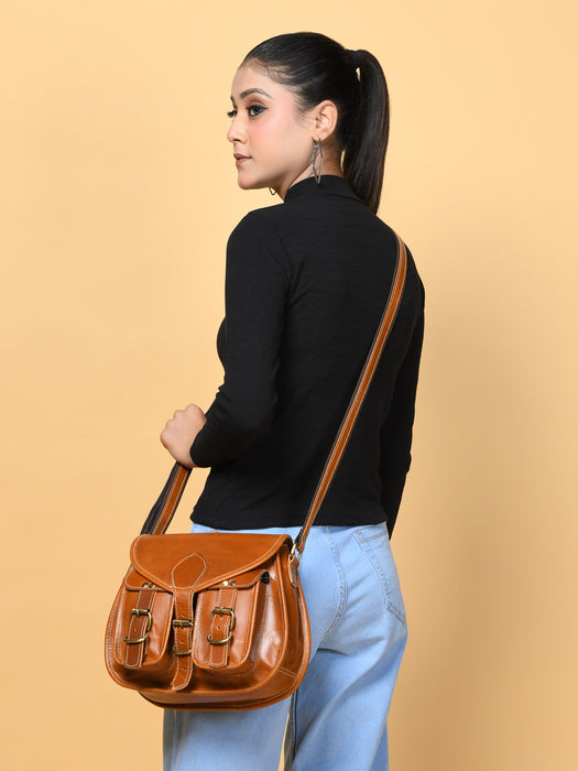 Woman carrying a brown leather bag against a beige background