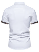 White polo shirt with floral cuffs on a white background
