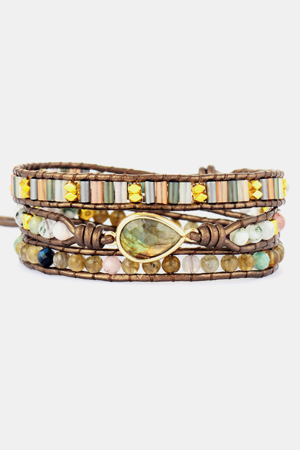 Multistrand beaded bracelet with a central gold teardrop bead on a white background