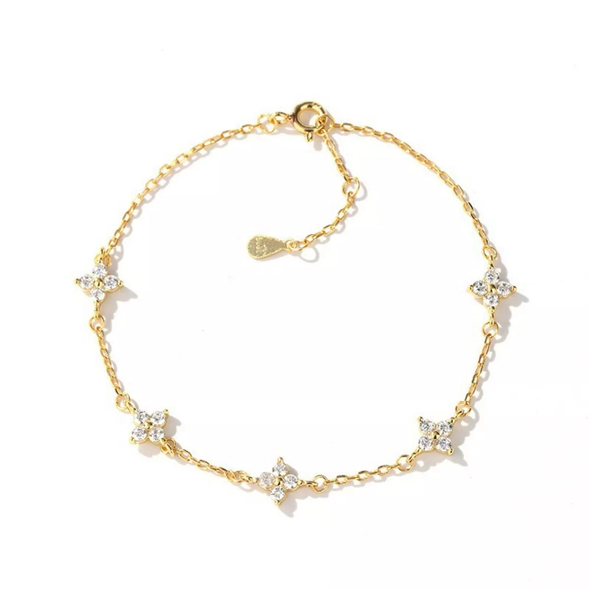 Gold bracelet with star-shaped charms on a white background