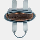The Small Handbag with Embossed Pattern Handles features a compact, structured design with detailed embossed handles for a refined look. It fits your essentials and offers versatile carrying options with a detachable strap. Perfect for both casual and formal settings, it combines elegance with practicality.