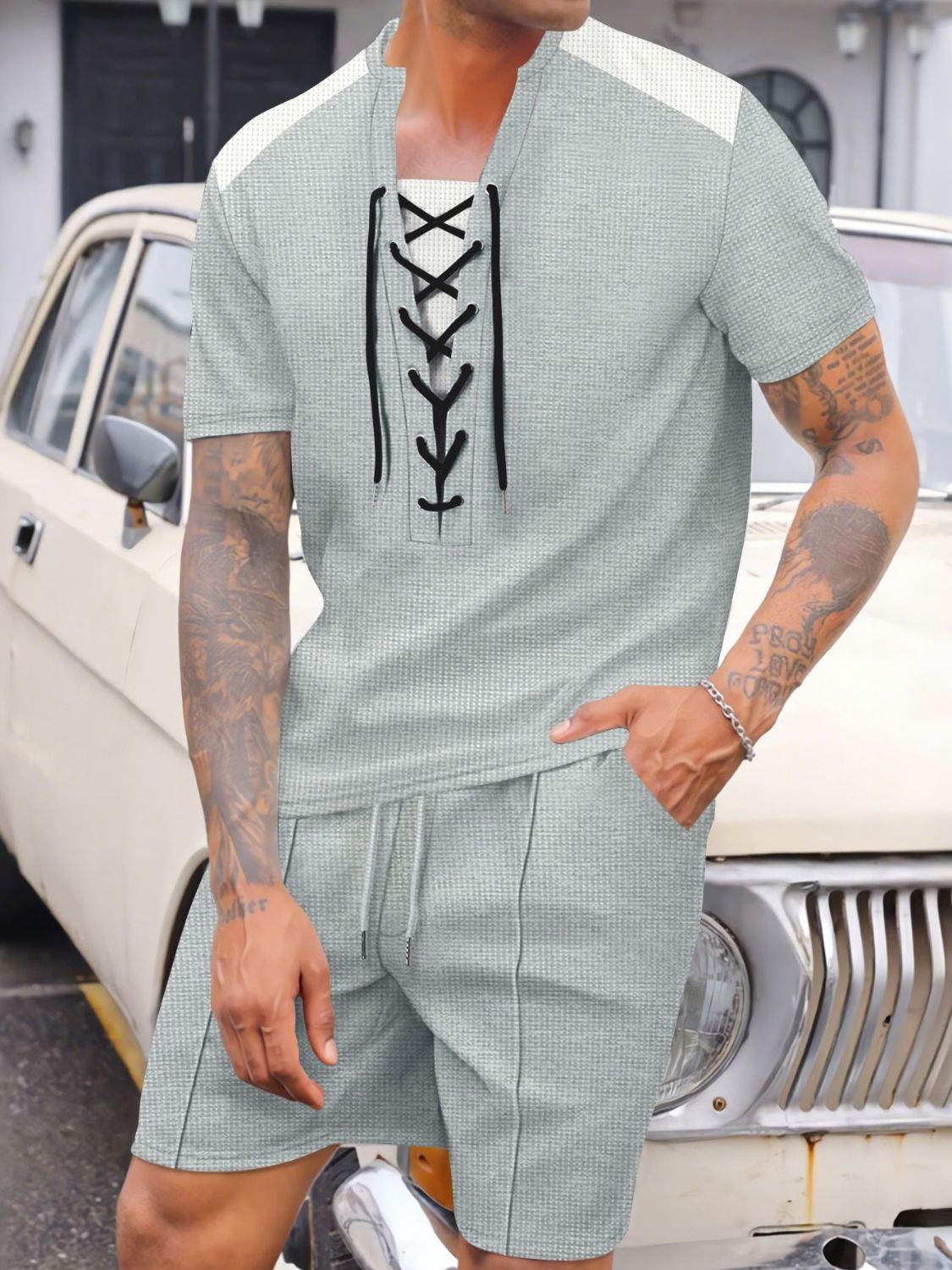 Experience comfort and style with our Men's Full Size Lace-Up Waffle Knit Top and Shorts Set! Made with soft and breathable waffle knit fabric, this set is designed to keep you cool and comfortable all day long. Plus, the lace-up detail adds a stylish touch that sets this set apart. Perfect for any occasion, in a full range of sizes!
