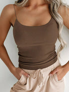 The Scoop Neck Cami features a streamlined, adaptable style perfect for layering or standalone wear. Designed with comfort and a flattering silhouette in mind, its scoop neckline adds subtle sophistication to any ensemble. Ideal for everyday use or as a foundational layer, this Cami blends simplicity with practicality to enhance your essential wardrobe pieces.