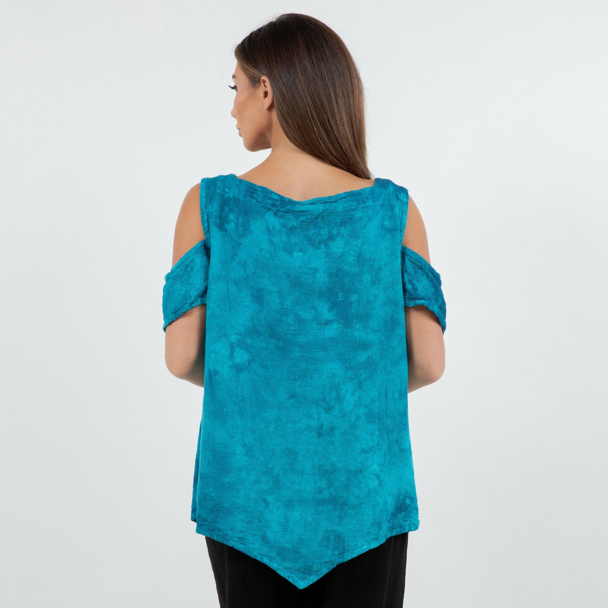 Woman showing the back, wearing a turquoise cold-shoulder top on a white background