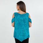 Woman showing the back, wearing a turquoise cold-shoulder top on a white background