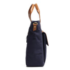Navy blue handbag with brown leather handles on a white background