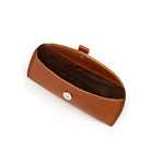 Brown leather eyeglass case on a white background