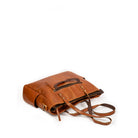 Brown leather bag on a white background