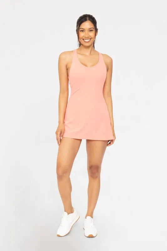 Woman wearing a pink dress on a white background