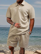 Men's luxury two-piece travel lounge set in a classic khaki tan textured dimensional knit.