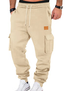 Beige cargo jogger pants worn by a person on a white background