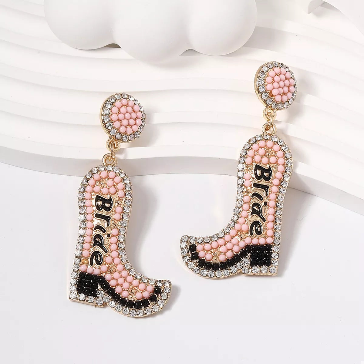 Cowboy boot earrings with 'Bride' text on a white background