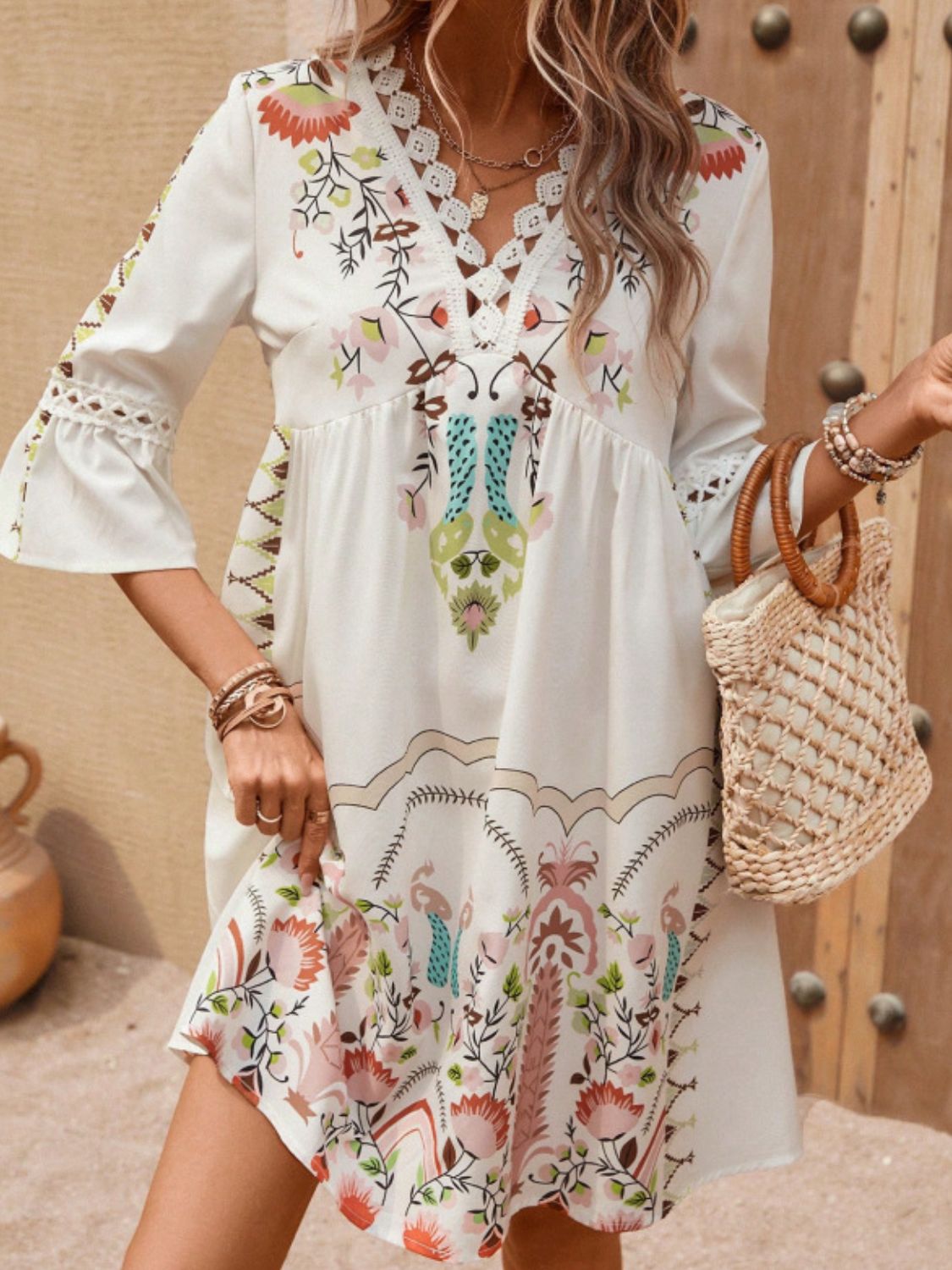 This luxurious dress features delicate lace and an intricate print for a stunning and sophisticated look. The three-quarter sleeves add a touch of elegance, making it a must-have for any occasion. Indulge in a sense of style and elevate your wardrobe with this Lace Detail Printed Three-Quarter Sleeve Dress.