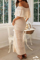Back view of the Riviera resort maxi dress, highlighting the premium knit texture and fluid, gracefully draping silhouette.