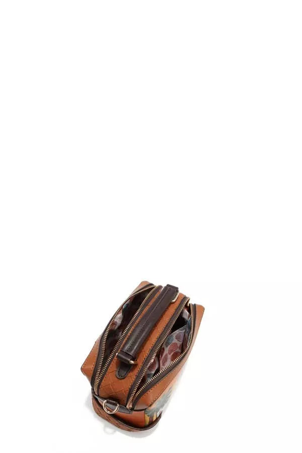 This Vegan Leather Sun and Sand 3-Piece Set includes a handbag, crossbody, and wallet featuring glossy patent accents. It has gold-tone hardware, an engraved logo, and a tropical print lining. Lightweight and stylish, it’s perfect for carrying your essentials with a touch of beach-inspired charm.