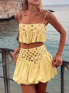 Make a striking entrance with the Eyelet Cami and Bubble Skirt Set. Featuring a daring eyelet cami that teases with subtle sheer details and a bold bubble skirt that adds volume and movement, this set redefines playful confidence. Perfect for those ready to stand out, it pairs comfort with a fearless edge to elevate your look and showcase your adventurous spirit.
