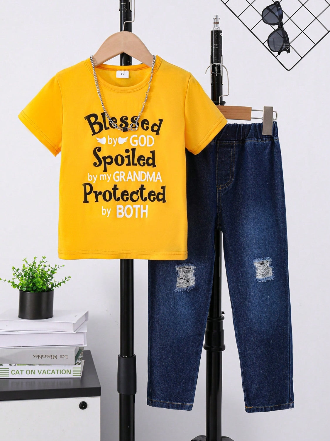Get your little one ready for a day filled with fun and style with our Children's Letter Graphic T-Shirt and Distressed Jeans Set! Made with comfortable fabrics and trendy distressed detailing, this set is perfect for active kids. Let their personality shine with the bold letter graphic on the t-shirt. The perfect combination of fashion and function for your child!