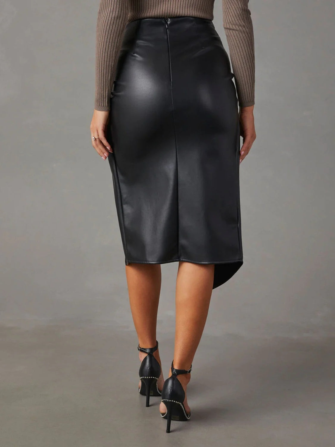 Elevate your style with our chic Twist Detail High Waist Skirt! Made with a flattering high waist, this skirt adds sophistication to any outfit. The unique twist detailing and open leg look create a sleek and elegant look, making a statement wherever you go. Feel confident and stylish in this must-have piece.
