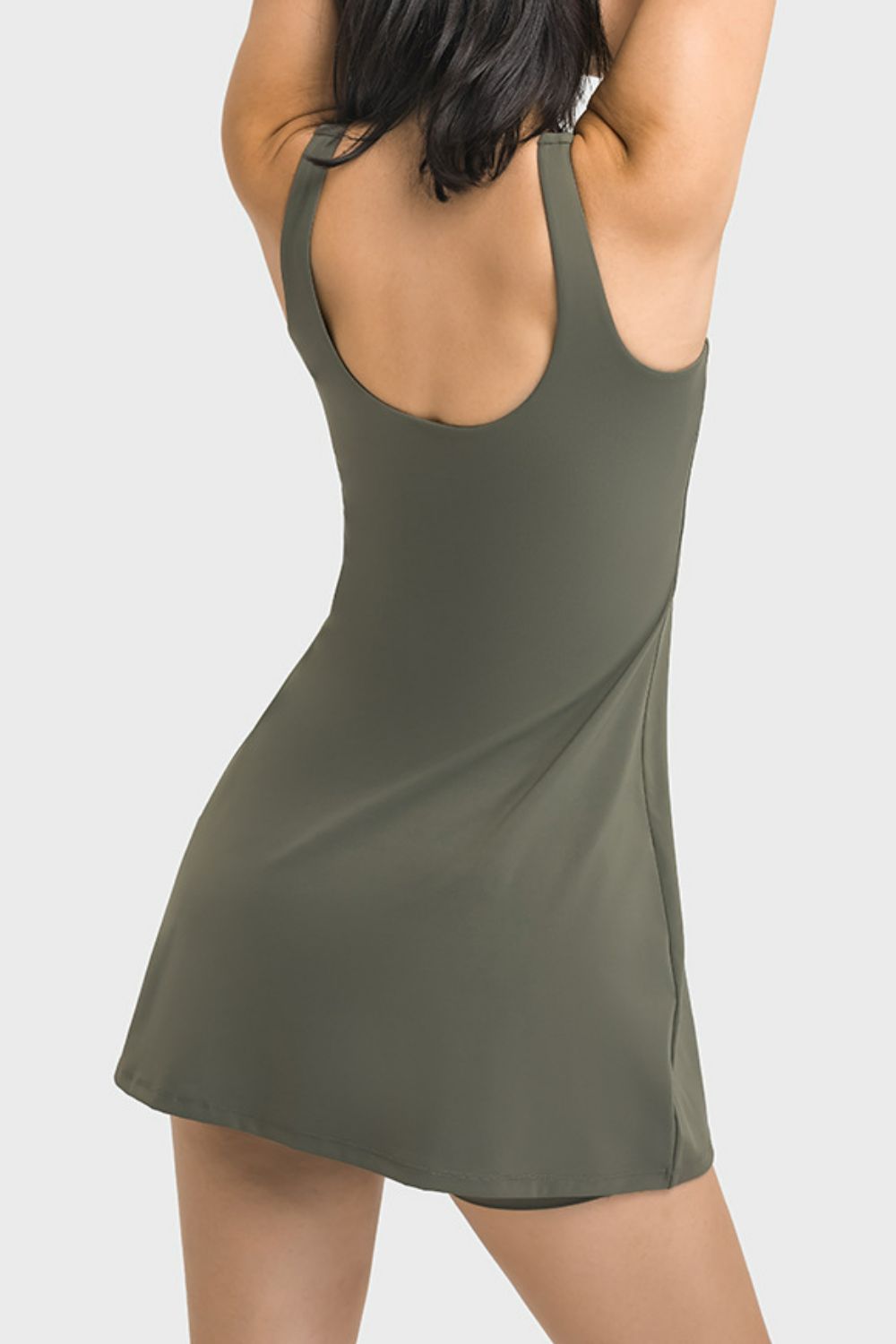 Introducing the Millennia Square Neck Sports Tank Dress! Stay comfortable and stylish in this versatile dress, perfect for the gym or on the go. The full coverage pocketed bottoms add convenience and functionality to your athletic wear. Order now for the ultimate combination of performance and fashion!