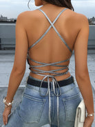 Elevate your wardrobe with the Backless Crisscross Tied Halter Cami Top - Adjustable, tailored for a chic, open-back style that flatters every silhouette. Featuring adjustable crisscross ties, it ensures a perfect, personalized fit that enhances comfort and shape. The sleek halter neckline adds a contemporary, minimalist touch, perfect for layering or wearing solo on warm days and evenings. Expertly designed for both fashion and functionality, this versatile Cami top effortlessly blends style with ease.