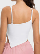 White tank top worn by a person on a white background