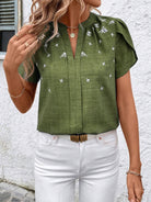 This Floral Notched Short Sleeve Blouse features a stylish notched neckline and a delicate floral print. Made from breathable fabric, it offers comfort for all-day wear and works well for both work and casual occasions.