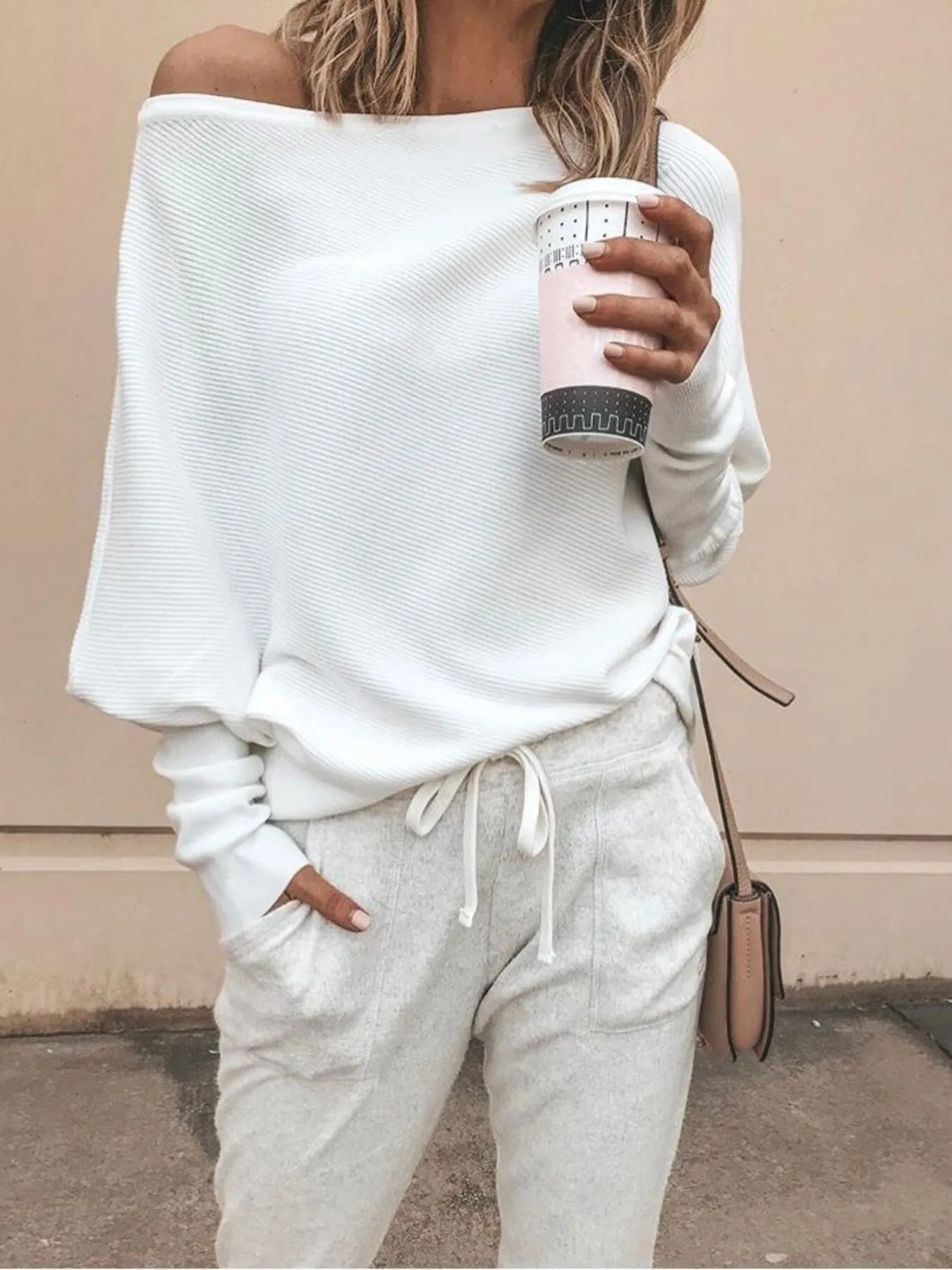 This Full Size One-Shoulder Ribbed Sweater hugs your curves with cozy ribbed fabric and a fun one-shoulder style. Perfect alone or layered, it adds playful comfort to your wardrobe. Available in sizes Small to 3XL. Machine wash cold, tumble dry low.