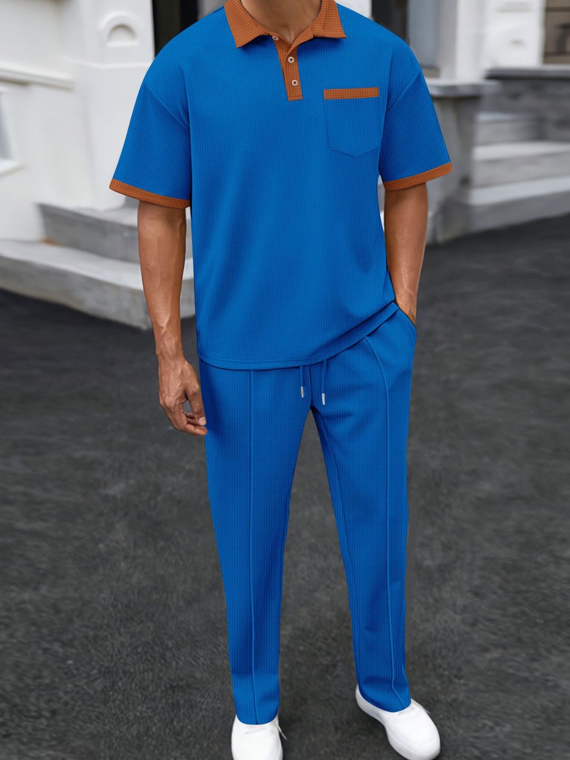Blue with beige trim accents. Elevate your wardrobe with our Men's Waffle-Knit Contrast Polo and Pants Set. Made with high-quality fabric and stylish accent color, this set offers a comfortable fit and a touch of sophistication. Available in a variety of colors and plus sizes for your convenience. Upgrade your style game today!