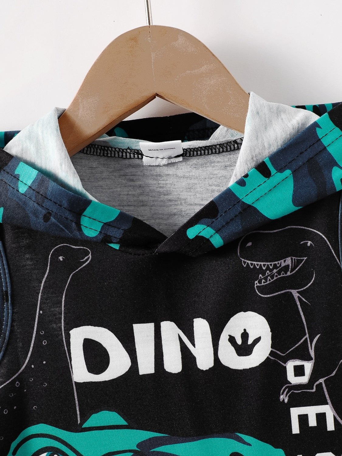 Unleash your child's imagination with our Children's Dinosaur Hooded Top and Pants Set! Made with soft and cozy material, this set features an adorable dinosaur design on the hooded top and matching pants. Keep them warm and stylish while they explore the prehistoric world.