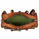 Brown leather duffel bag with green interior on a white background