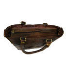 Brown leather bag with gold hardware on a white background