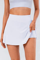 White High Waisted Pleated Active Skirt. Designed for style and performance, this skort features tummy control and a pocket for convenience